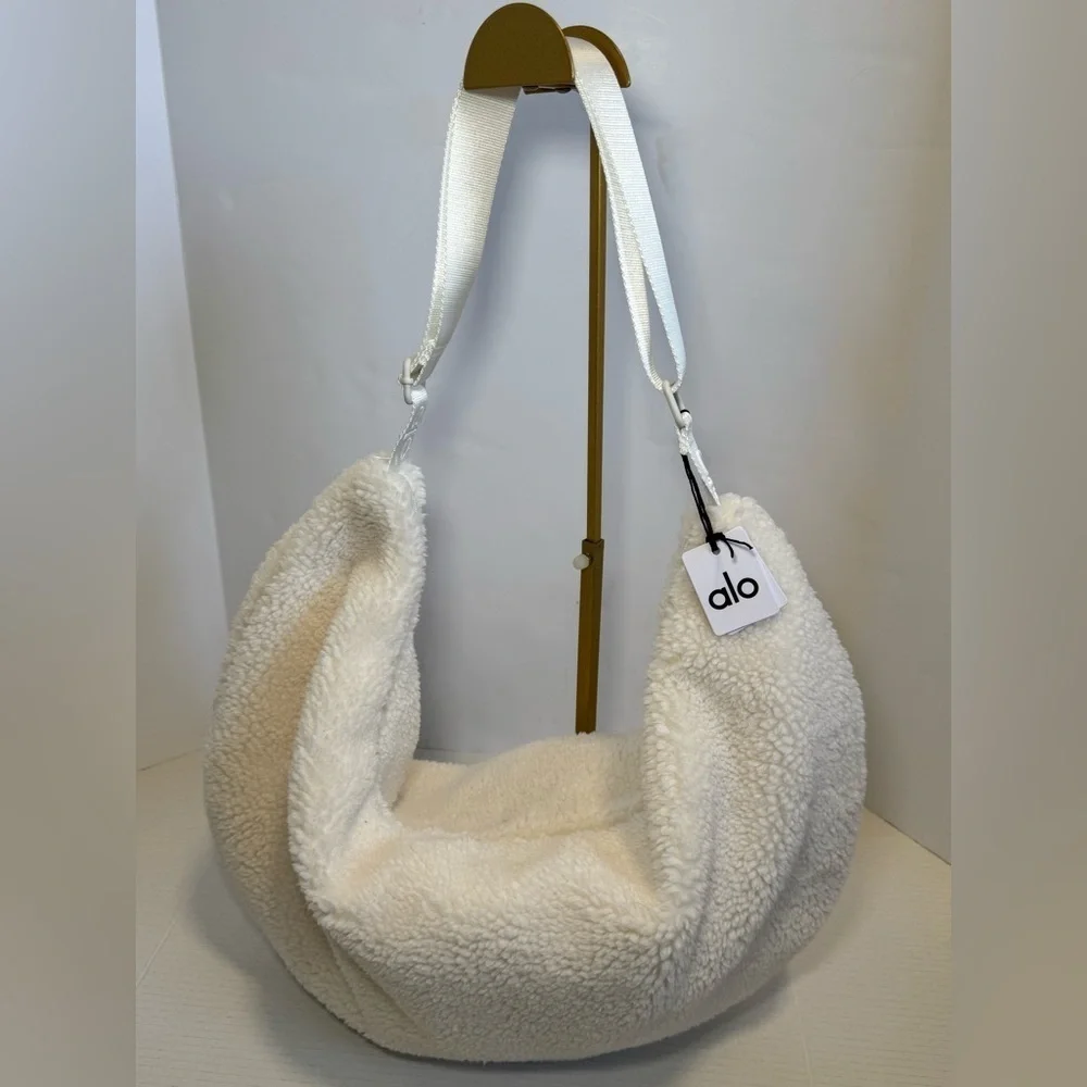 Alo Yoga Sherpa On The Go Sling Bag in ivory